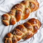 2 small challah loafs on a white napkin